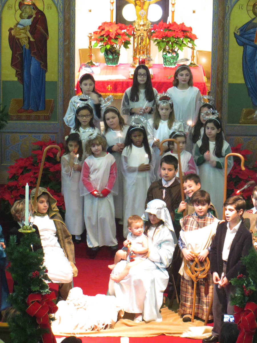 Children in costume for the nativity pageant, gathered in the nave of the church.